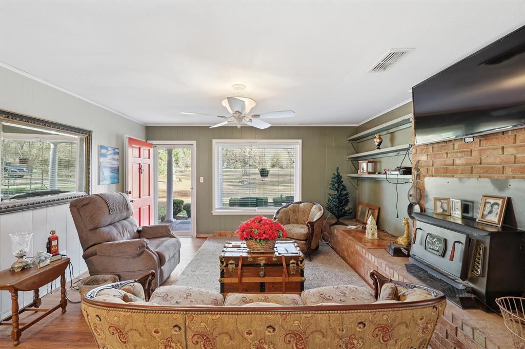 240 Fm 3421 Daingerfield, TX 75638 - Photo 5 of 27 a living room with furniture and a floor to ceiling window
