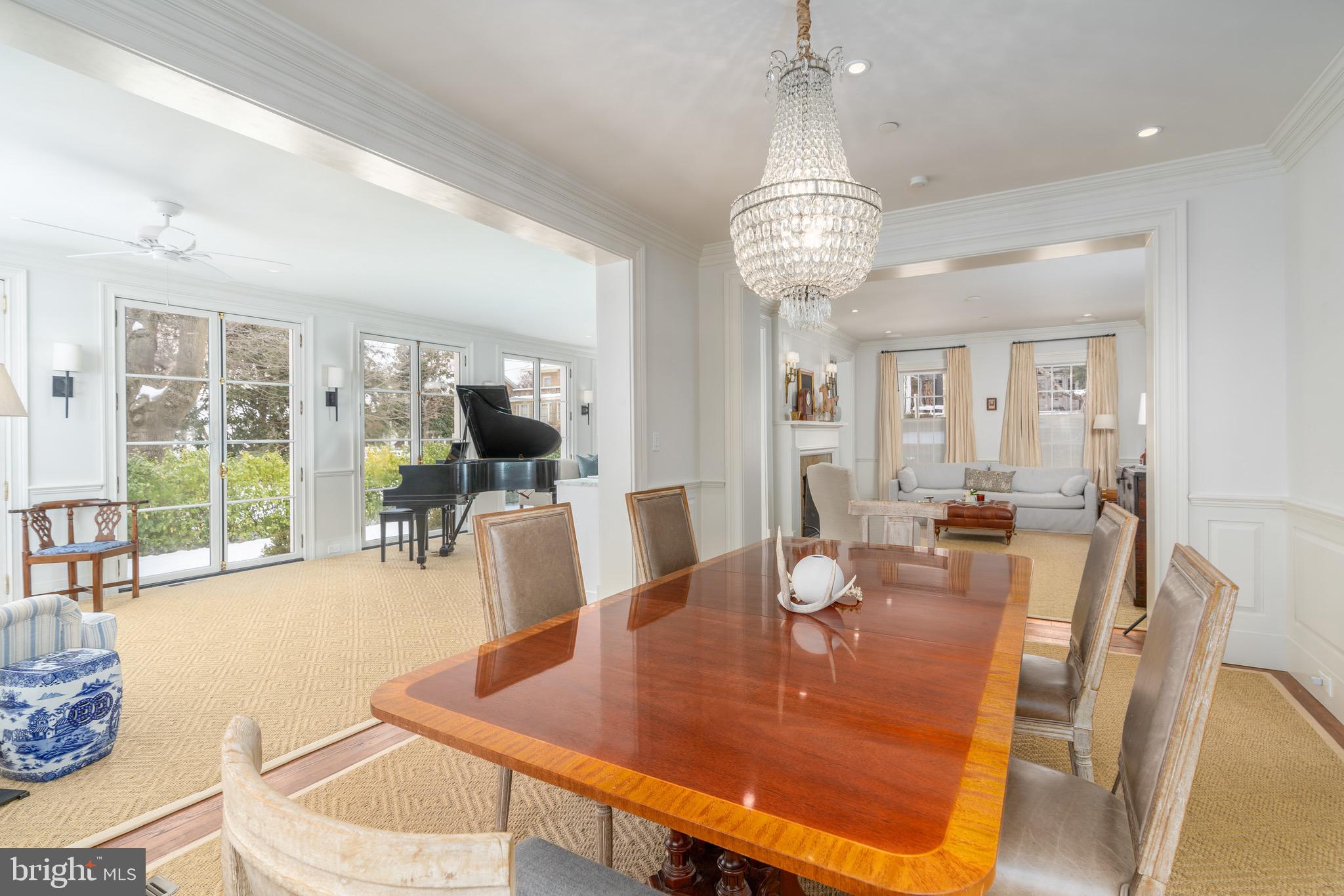 2701 36th Street Northwest Washington, DC 20007 - Photo 17 of 62 a view of a dining room with furniture wooden floor and chandelier