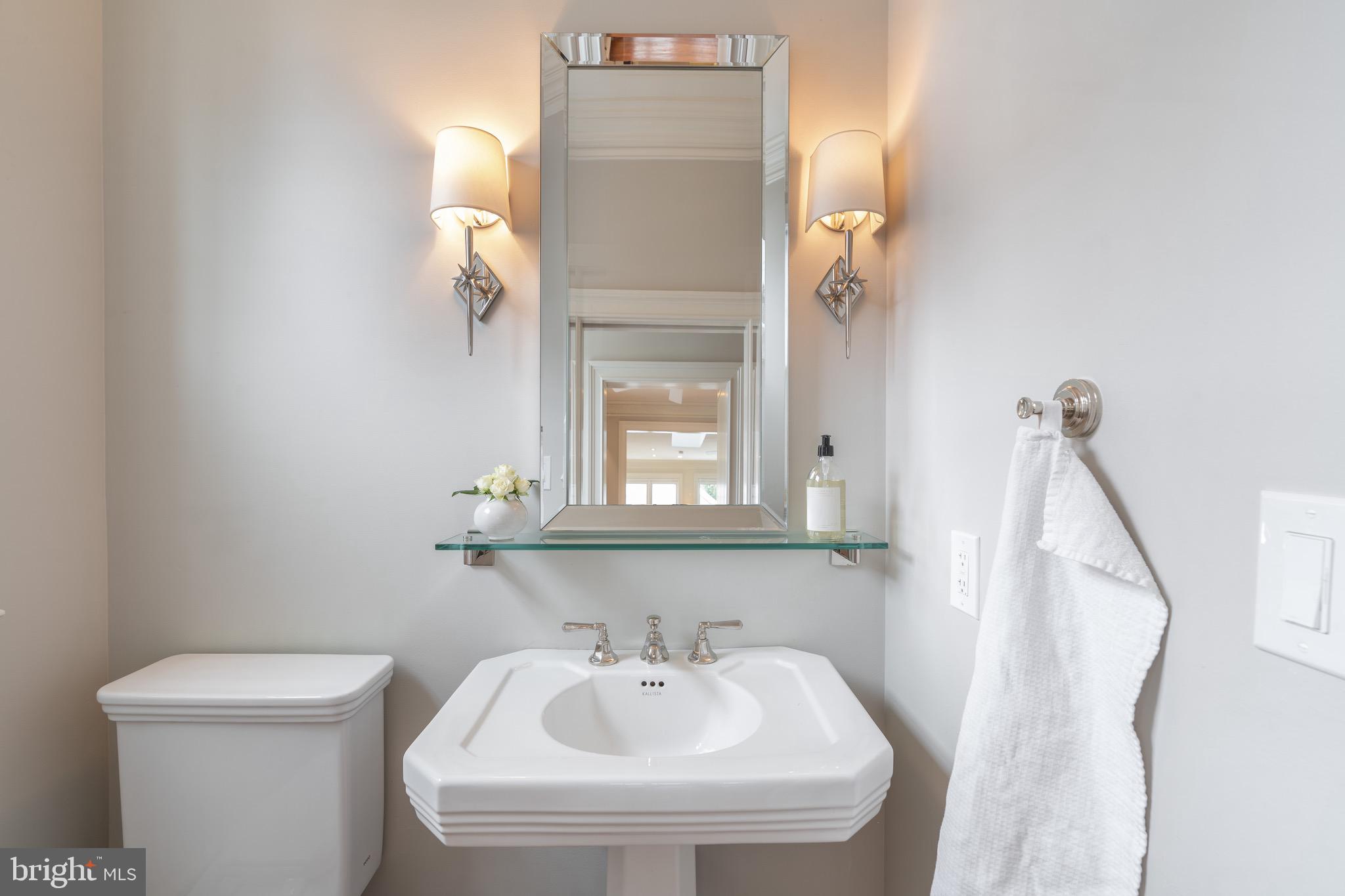 2701 36th Street Northwest Washington, DC 20007 - Photo 18 of 62 a bathroom with a toilet sink and mirror