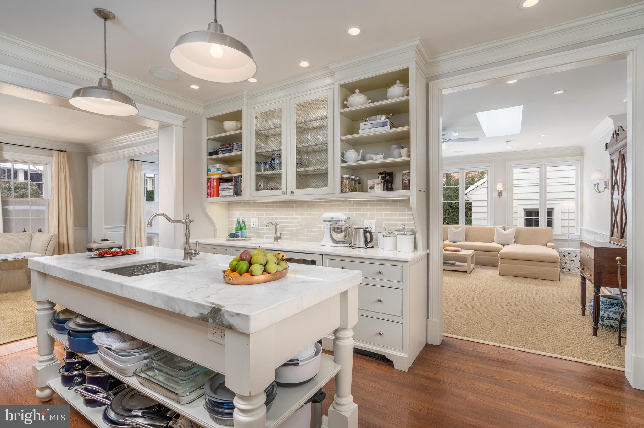 2701 36th Street Northwest Washington, DC 20007 - Photo 24 of 62 a kitchen with a sink stove and wooden floor