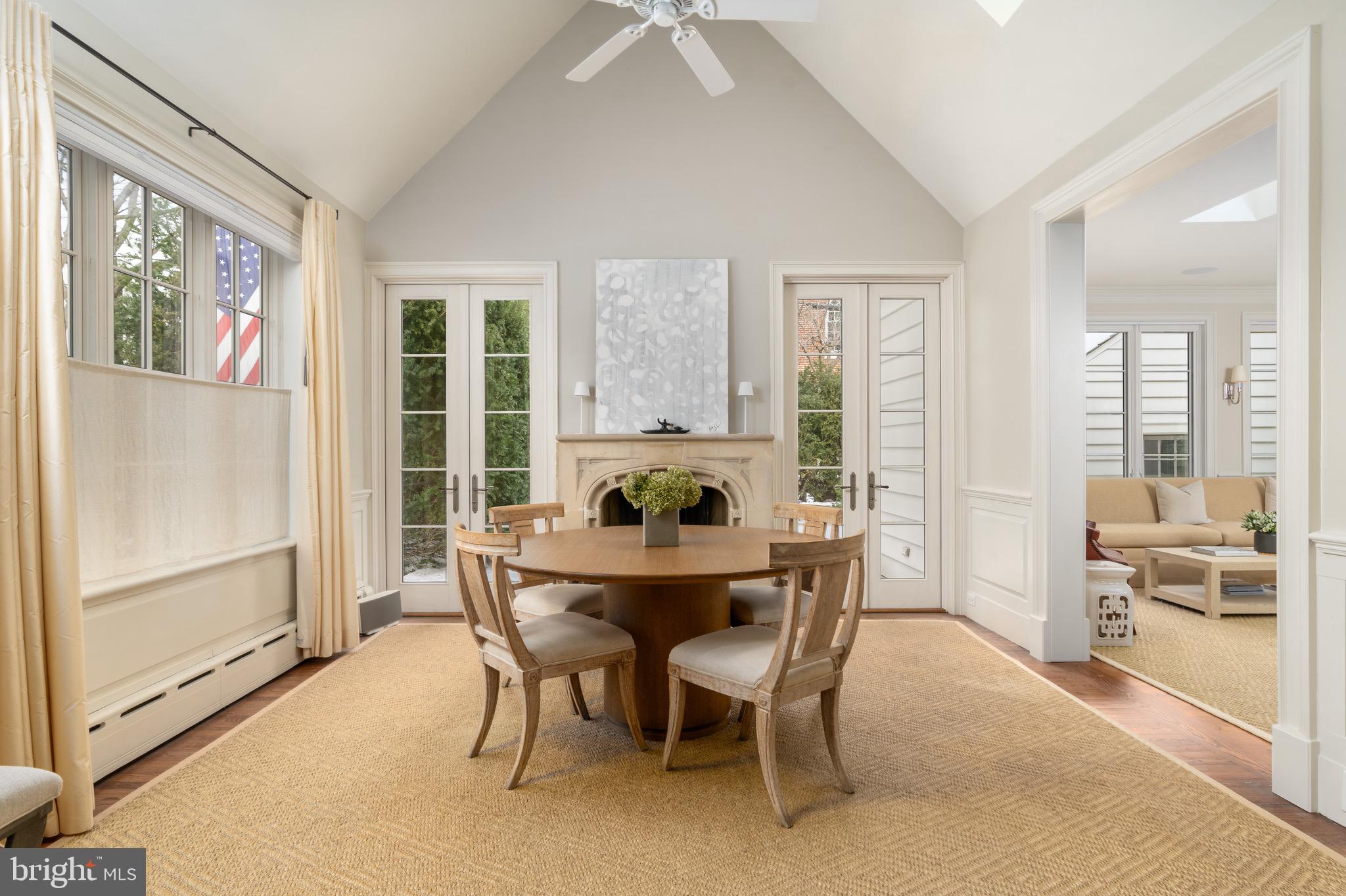 2701 36th Street Northwest Washington, DC 20007 - Photo 25 of 62 a dining room with furniture a chandelier and wooden floor