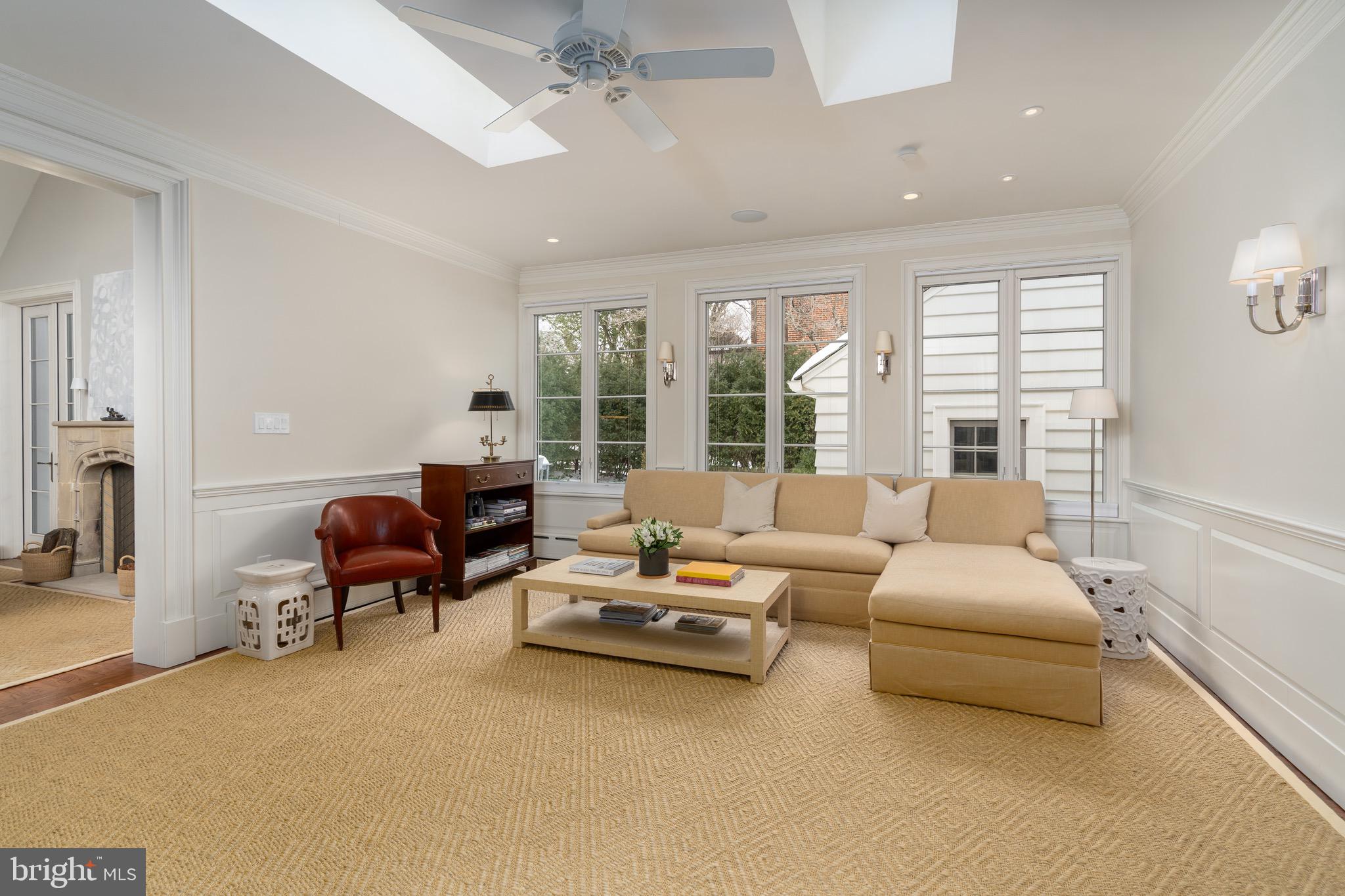 2701 36th Street Northwest Washington, DC 20007 - Photo 27 of 62 a living room with furniture and large windows