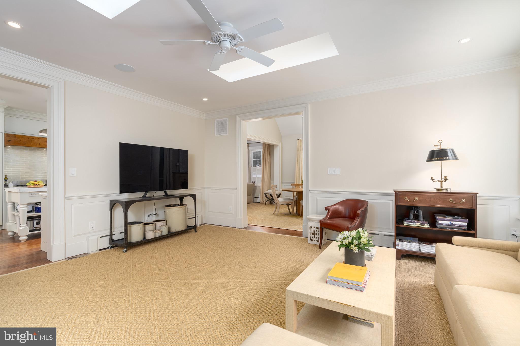 2701 36th Street Northwest Washington, DC 20007 - Photo 28 of 62 a living room with furniture and a flat screen tv
