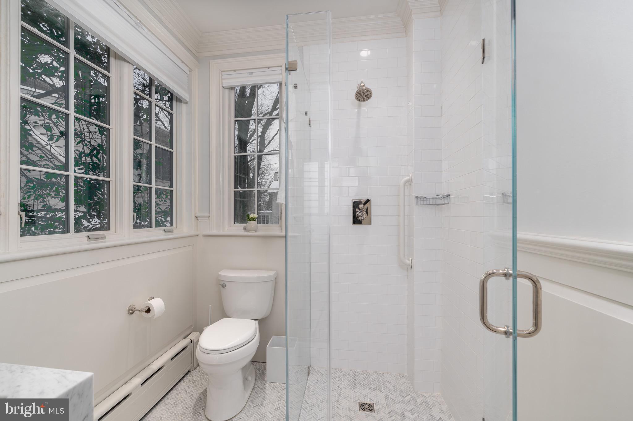 2701 36th Street Northwest Washington, DC 20007 - Photo 29 of 62 a bathroom with a granite countertop shower a toilet and a sink