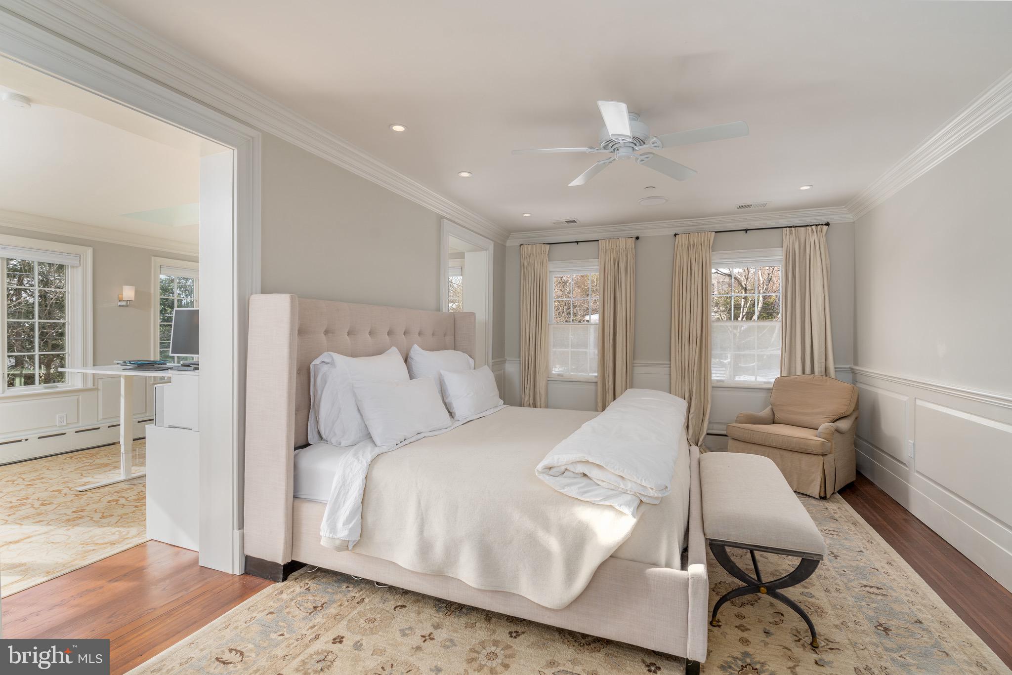2701 36th Street Northwest Washington, DC 20007 - Photo 32 of 62 a bedroom with a large bed and wooden floor