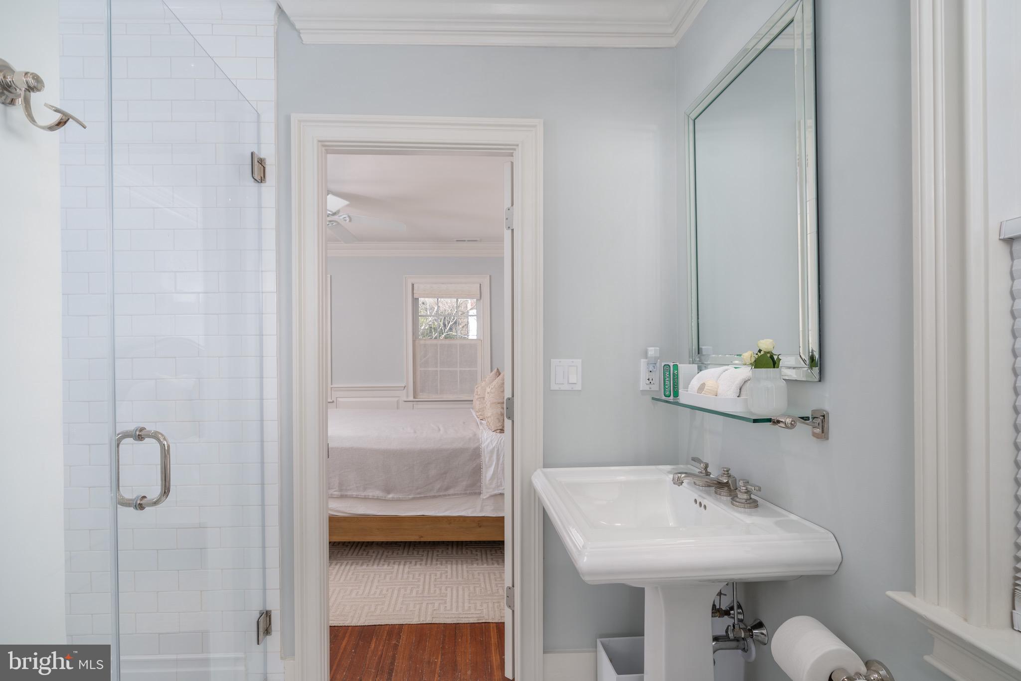 2701 36th Street Northwest Washington, DC 20007 - Photo 43 of 62 a bathroom with a sink a toilet and shower