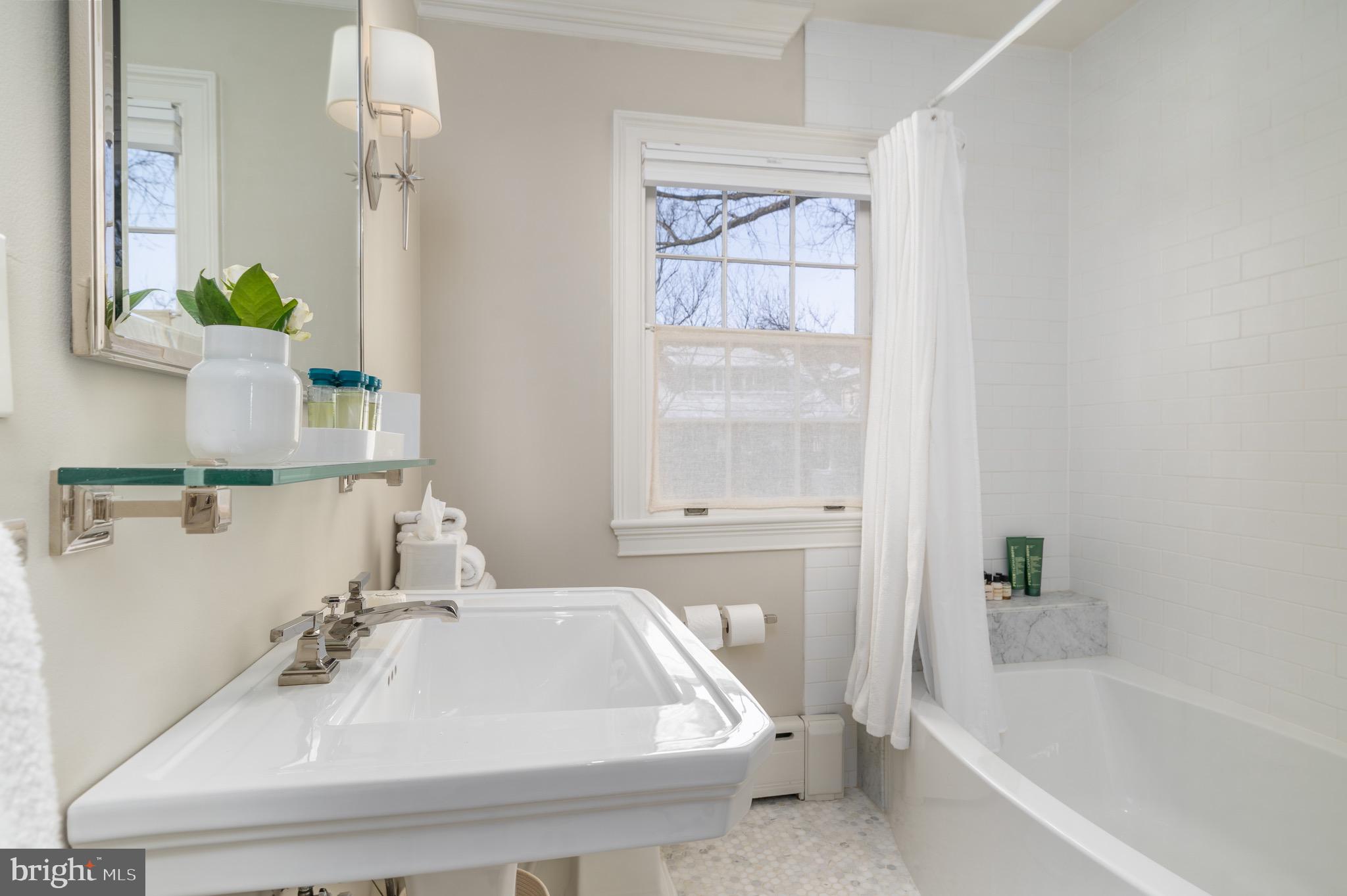 2701 36th Street Northwest Washington, DC 20007 - Photo 44 of 62 a bathroom with a sink and a bathtub