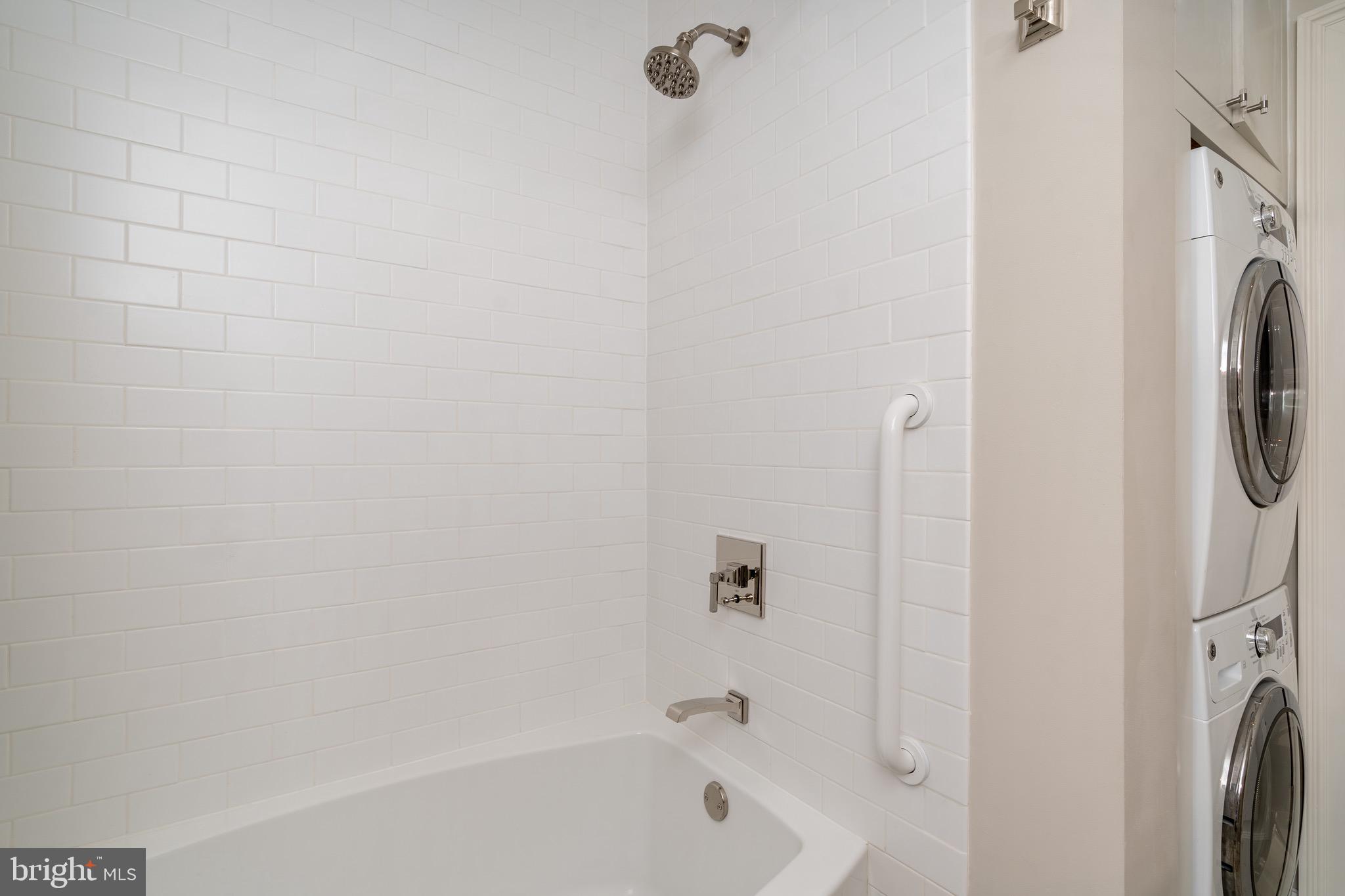 2701 36th Street Northwest Washington, DC 20007 - Photo 45 of 62 a bathroom with a bathtub and a shower