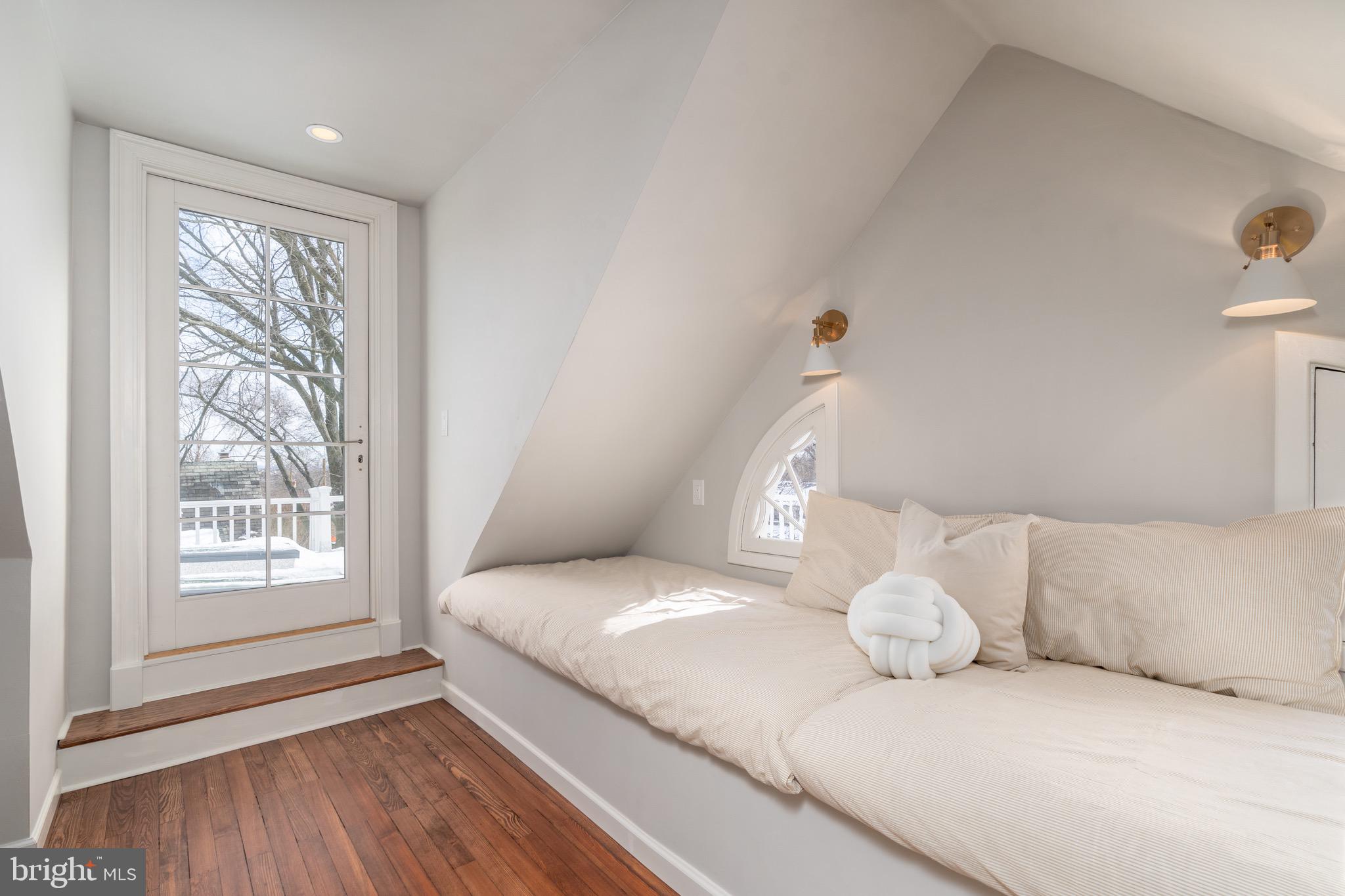 2701 36th Street Northwest Washington, DC 20007 - Photo 50 of 62 a bedroom with a bed and a window
