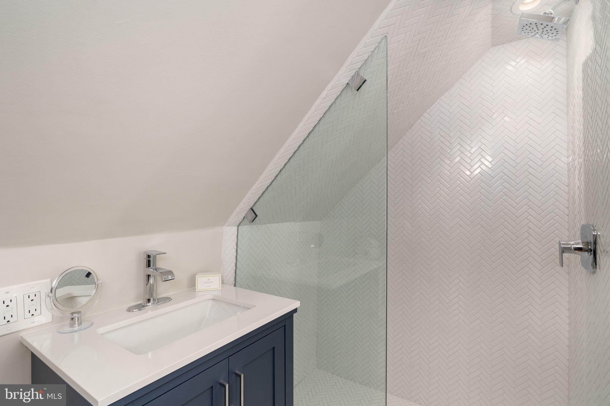 2701 36th Street Northwest Washington, DC 20007 - Photo 51 of 62 a bathroom with a sink vanity and a mirror