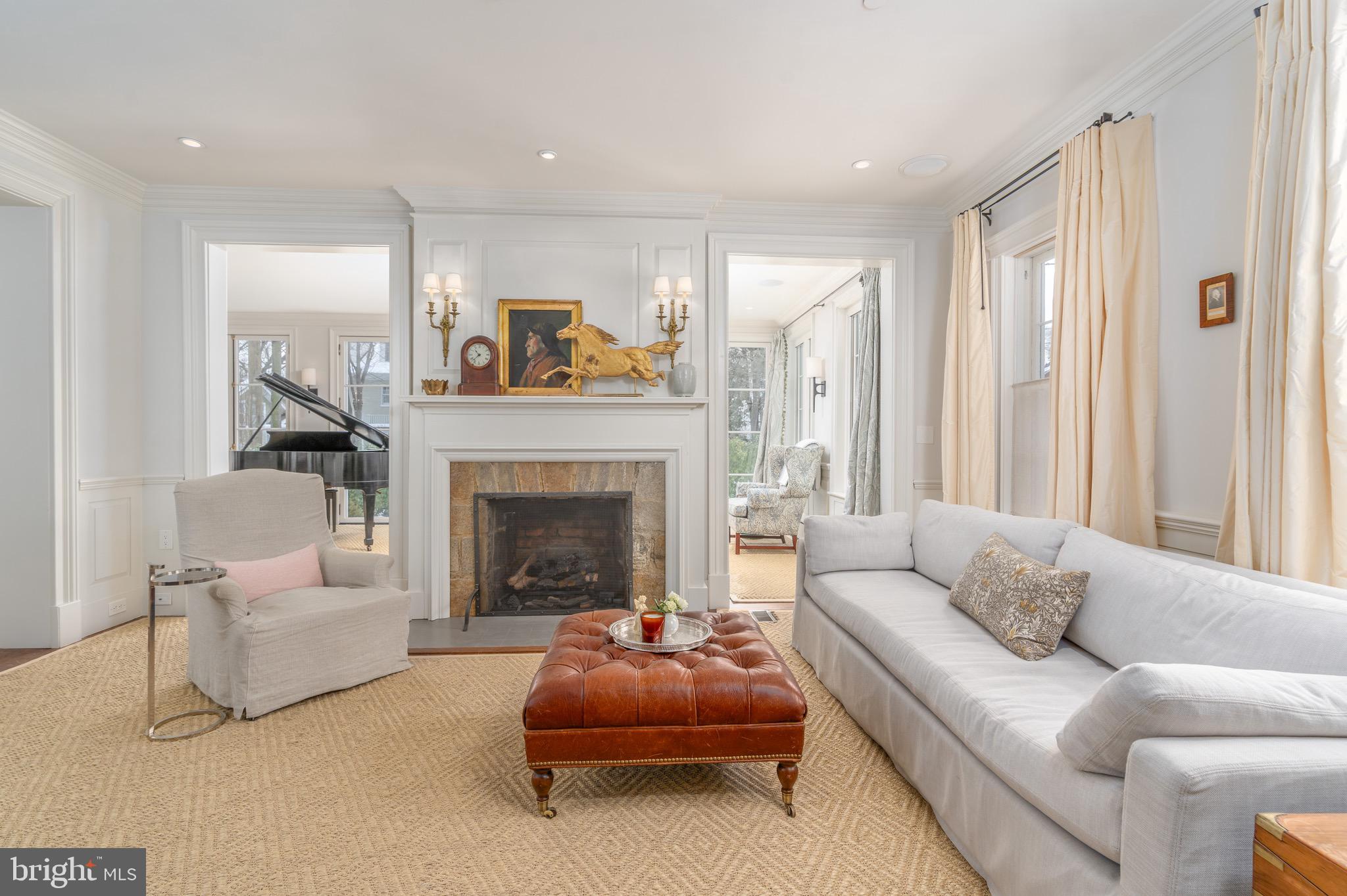 2701 36th Street Northwest Washington, DC 20007 - Photo 7 of 62 a living room with furniture and a fireplace