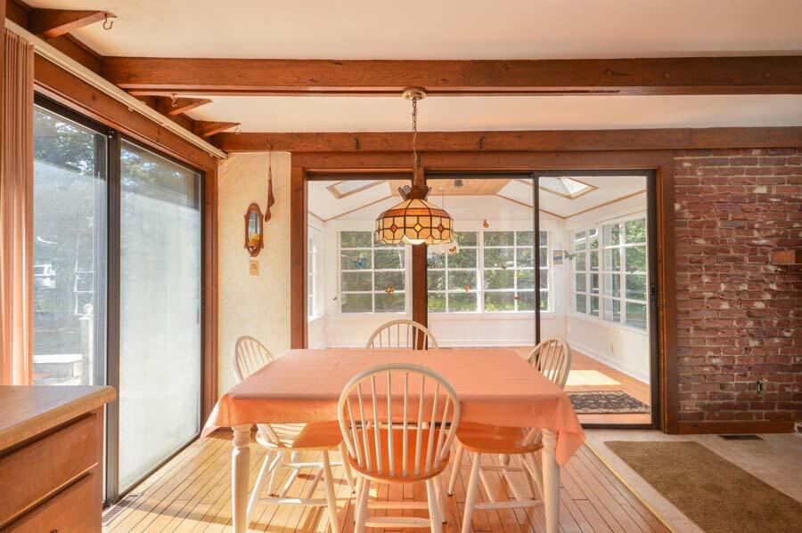 8 Treasure Lane Mashpee, MA 02649 - Photo 11 of 17 a dining room with a large window and table