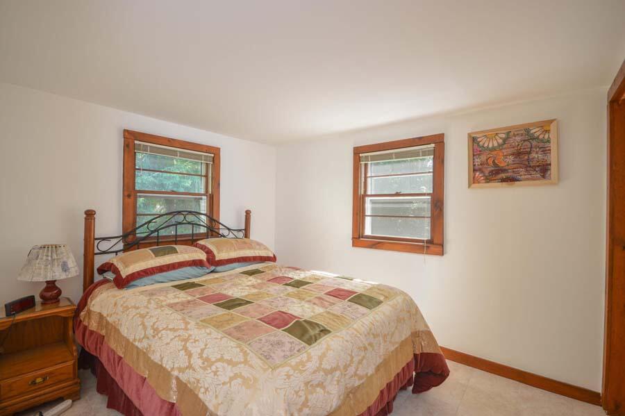8 Treasure Lane Mashpee, MA 02649 - Photo 14 of 17 a bedroom with a bed and a window