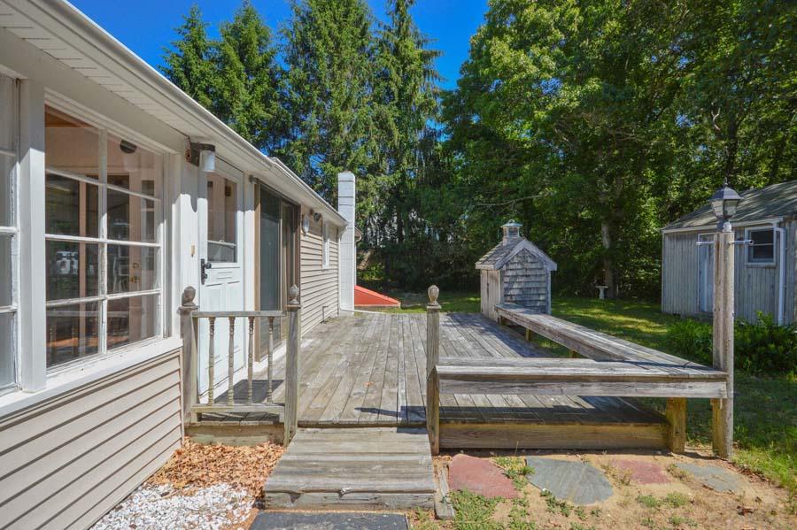 8 Treasure Lane Mashpee, MA 02649 - Photo 3 of 17 a front view of a house with a porch