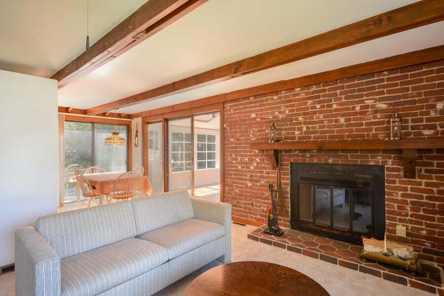 8 Treasure Lane Mashpee, MA 02649 - Photo 8 of 17 a living room with furniture and a fireplace