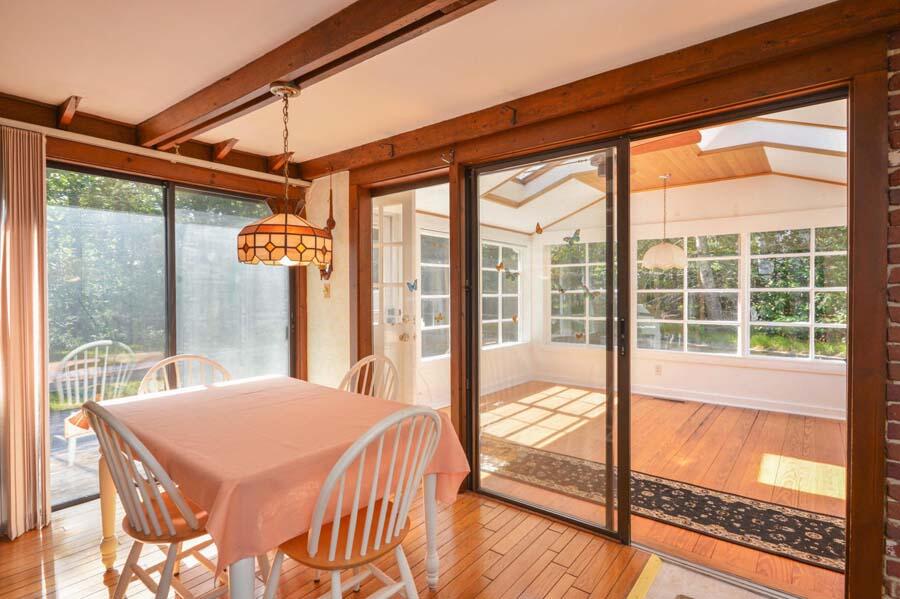 8 Treasure Lane Mashpee, MA 02649 - Photo 10 of 17 a bedroom with a bed and a large window with outer view