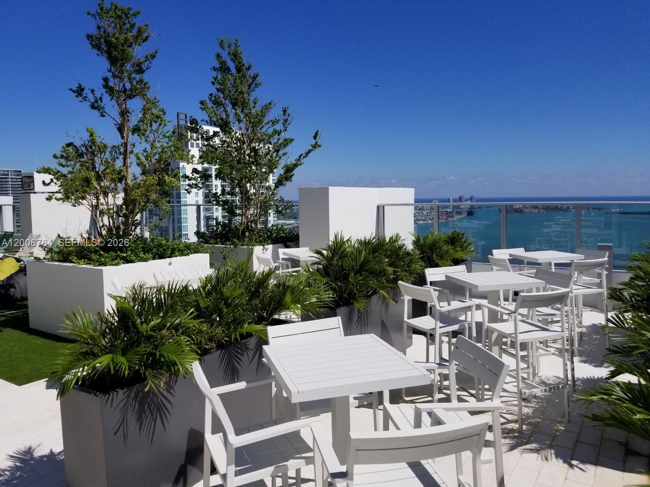 1010 Brickell Avenue, Unit 3205 Miami, FL 33131 - Photo 31 of 35 seating area by pool