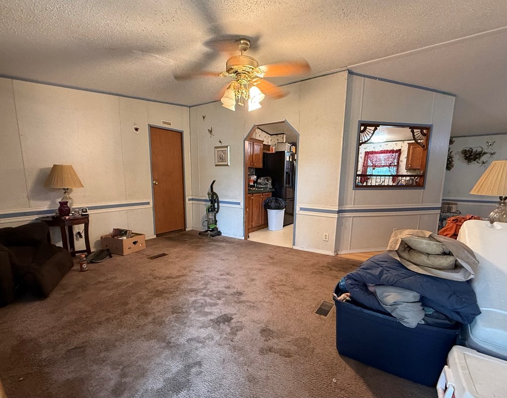 920 Pioneer Road Grimsley, TN 38565 - Photo 3 of 15 a living room with furniture gym equipment and a chandelier
