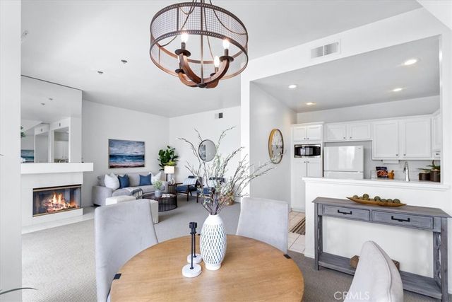 a living room with fireplace furniture and a wooden floor