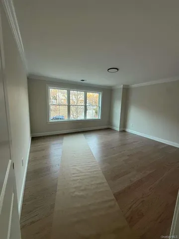 a spacious bathroom with a double vanity sink a toilet and a tub