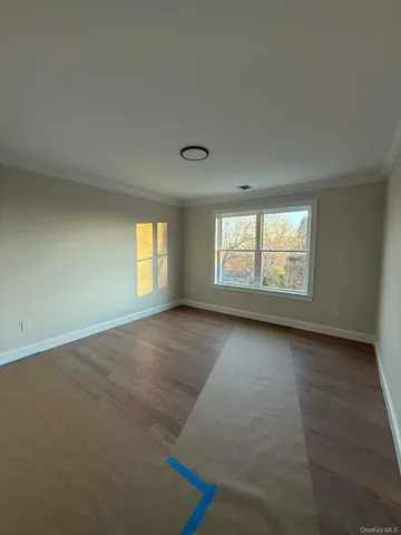 a view of empty room with staircase