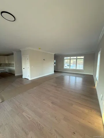 a view of a house with wooden deck