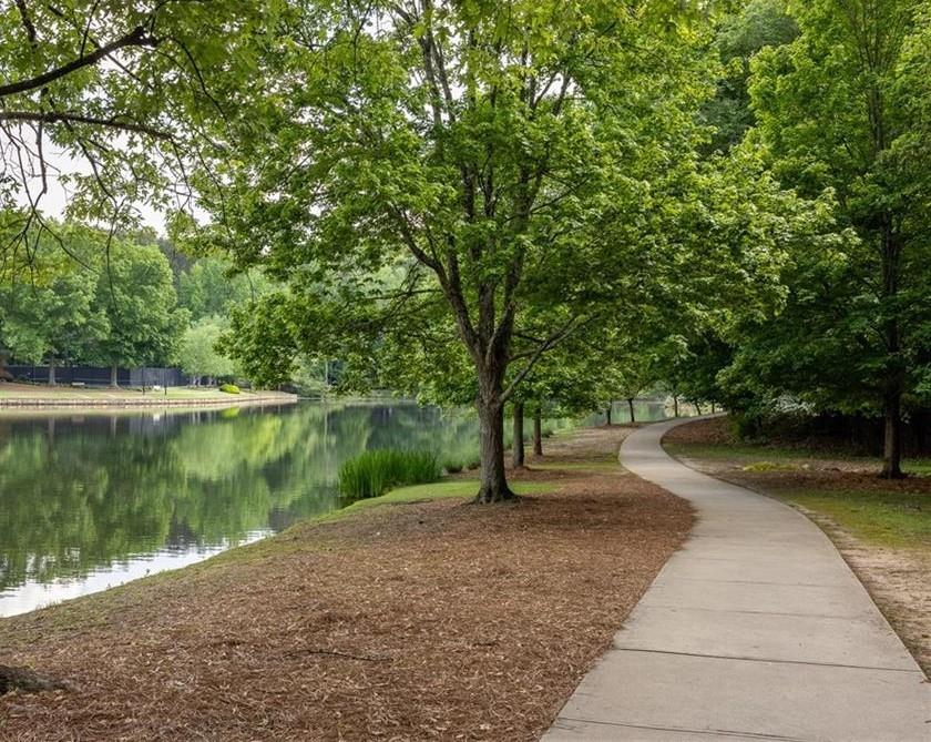 227 Quail Run Roswell, GA 30076 - Photo 14 of 20 a view of a lake view with a garden