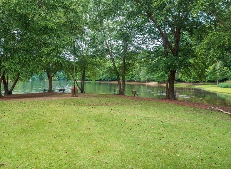 227 Quail Run Roswell, GA 30076 - Photo 16 of 20 a backyard of a house with lots of green space