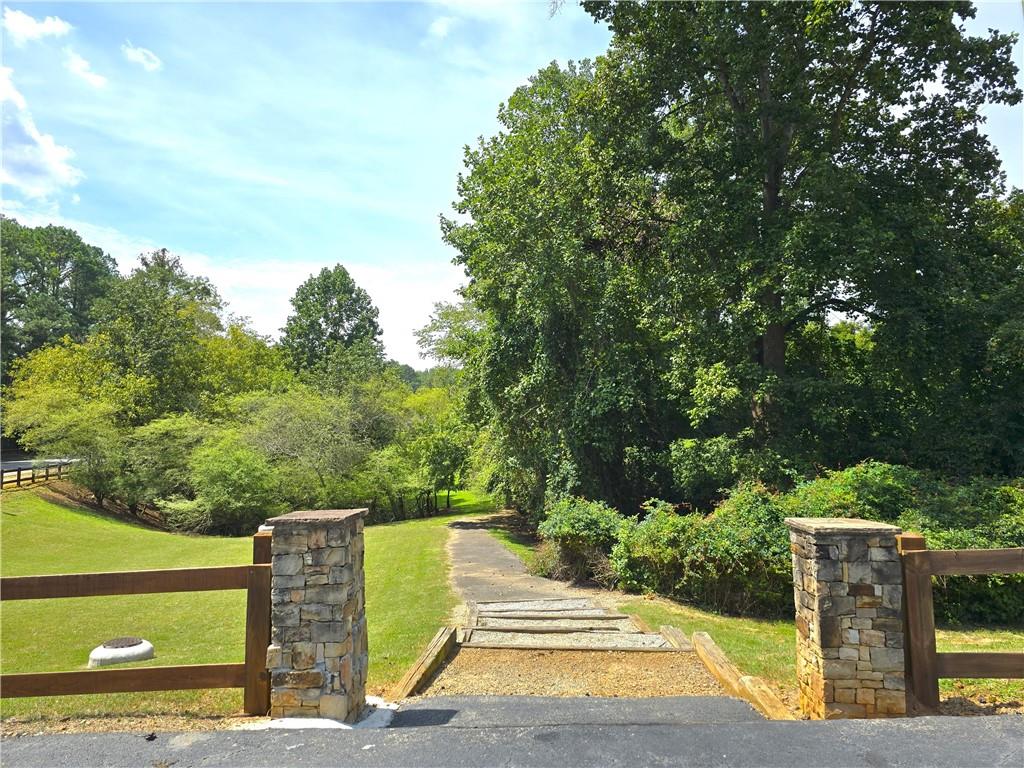 227 Quail Run Roswell, GA 30076 - Photo 18 of 20 a view of a street with benches in the background