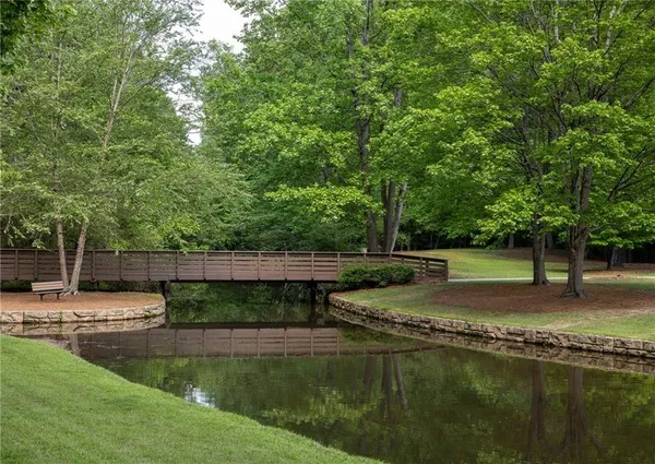 a view of a backyard with a lake view