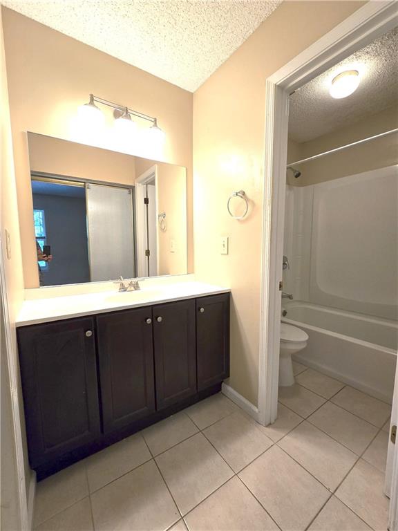 227 Quail Run Roswell, GA 30076 - Photo 6 of 20 a spacious bathroom with a double vanity sink toilet and a shower