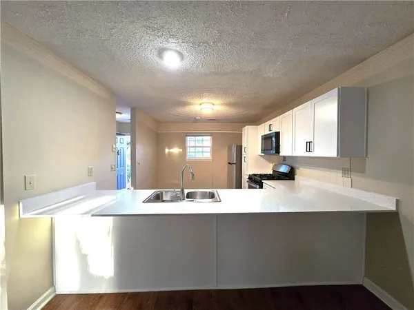 a large bathroom with a sink mirror and vanity