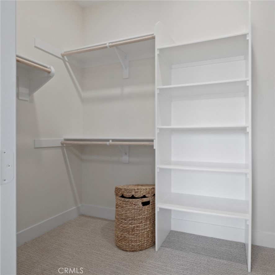 161 Scoville Irvine, CA 92618 - Photo 12 of 34 a living room with a wooden floor and a cabinet