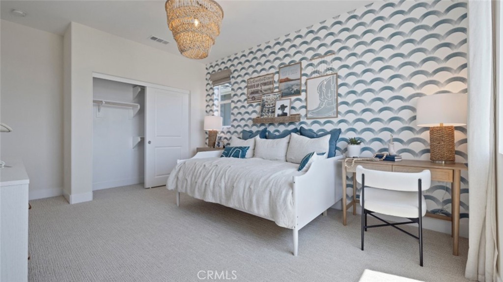 161 Scoville Irvine, CA 92618 - Photo 14 of 34 a bedroom with a bed and chair