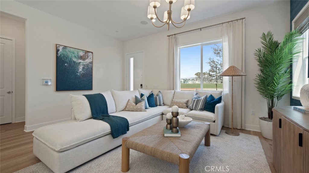 161 Scoville Irvine, CA 92618 - Photo 6 of 34 a living room with furniture and a chandelier