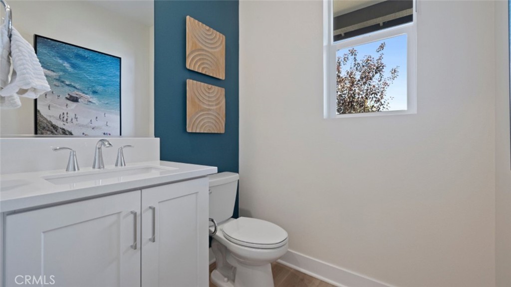 161 Scoville Irvine, CA 92618 - Photo 8 of 34 a bathroom with a toilet sink and mirror