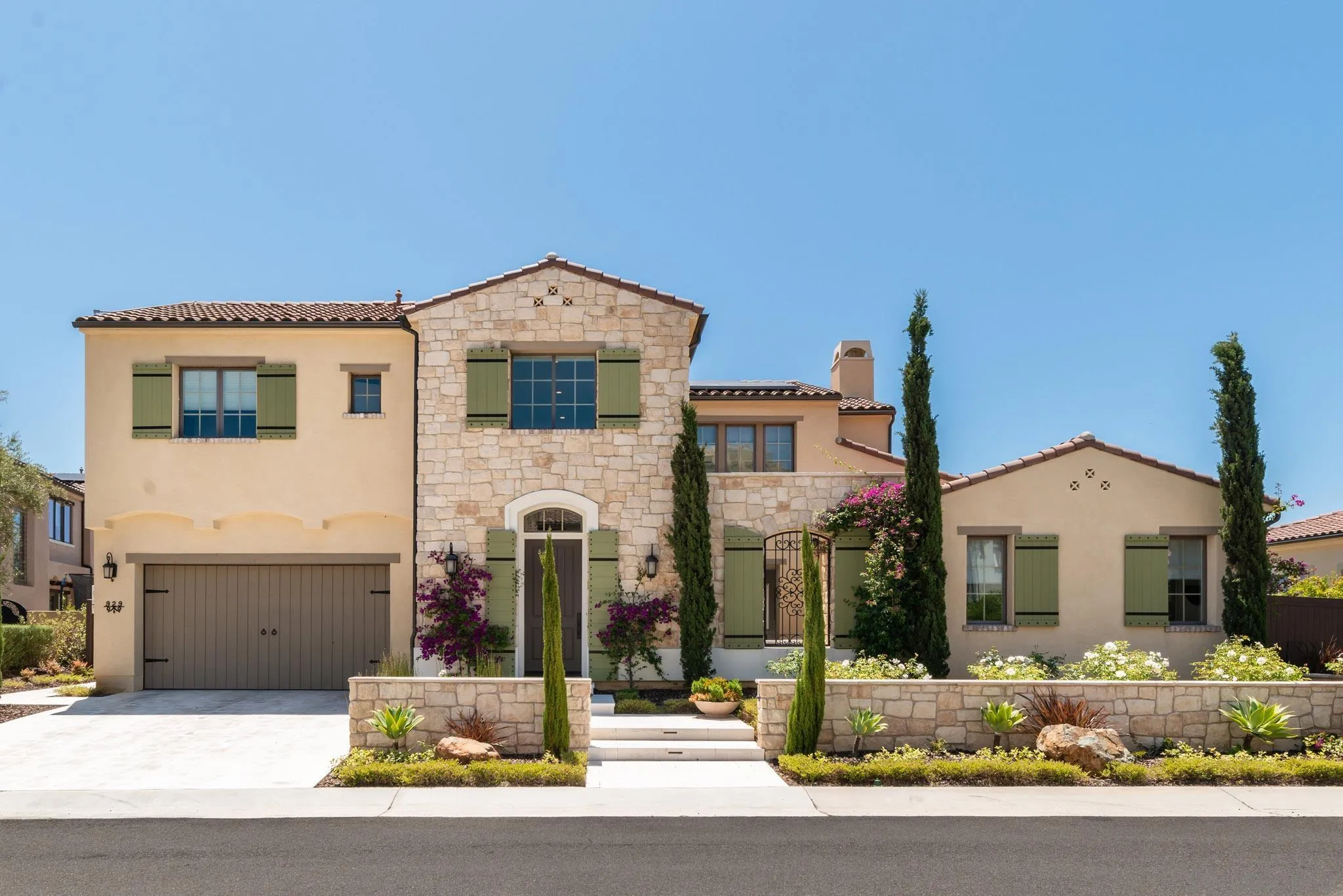 a front view of a house with garage