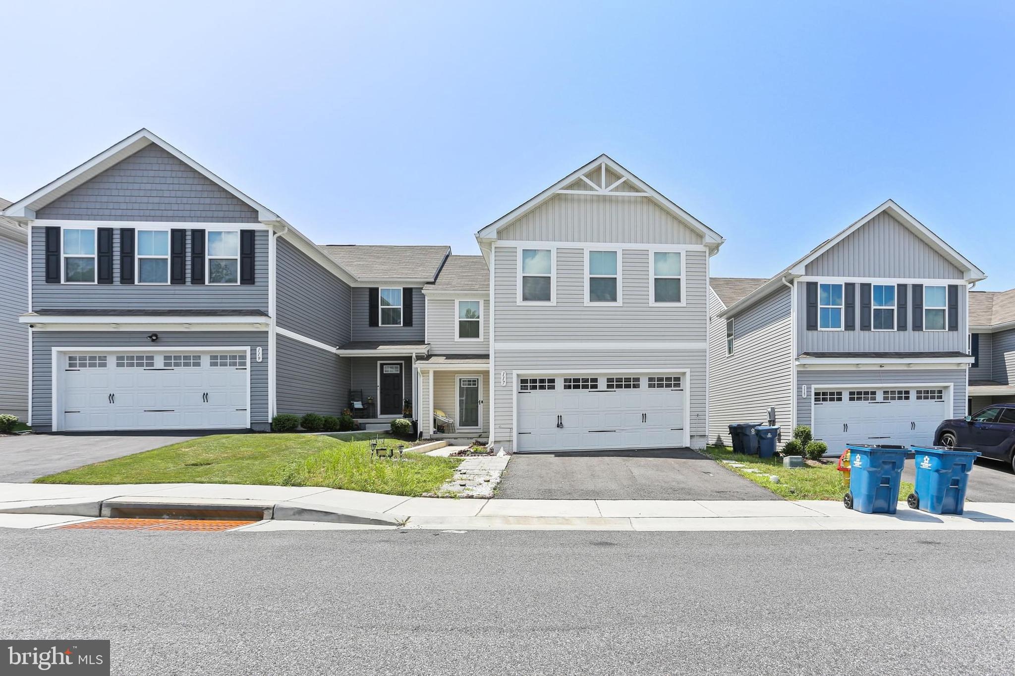 117 Magnolia Drive Elkton, MD 21921 - Photo 1 of 3 a front view of a house with a yard and a garage