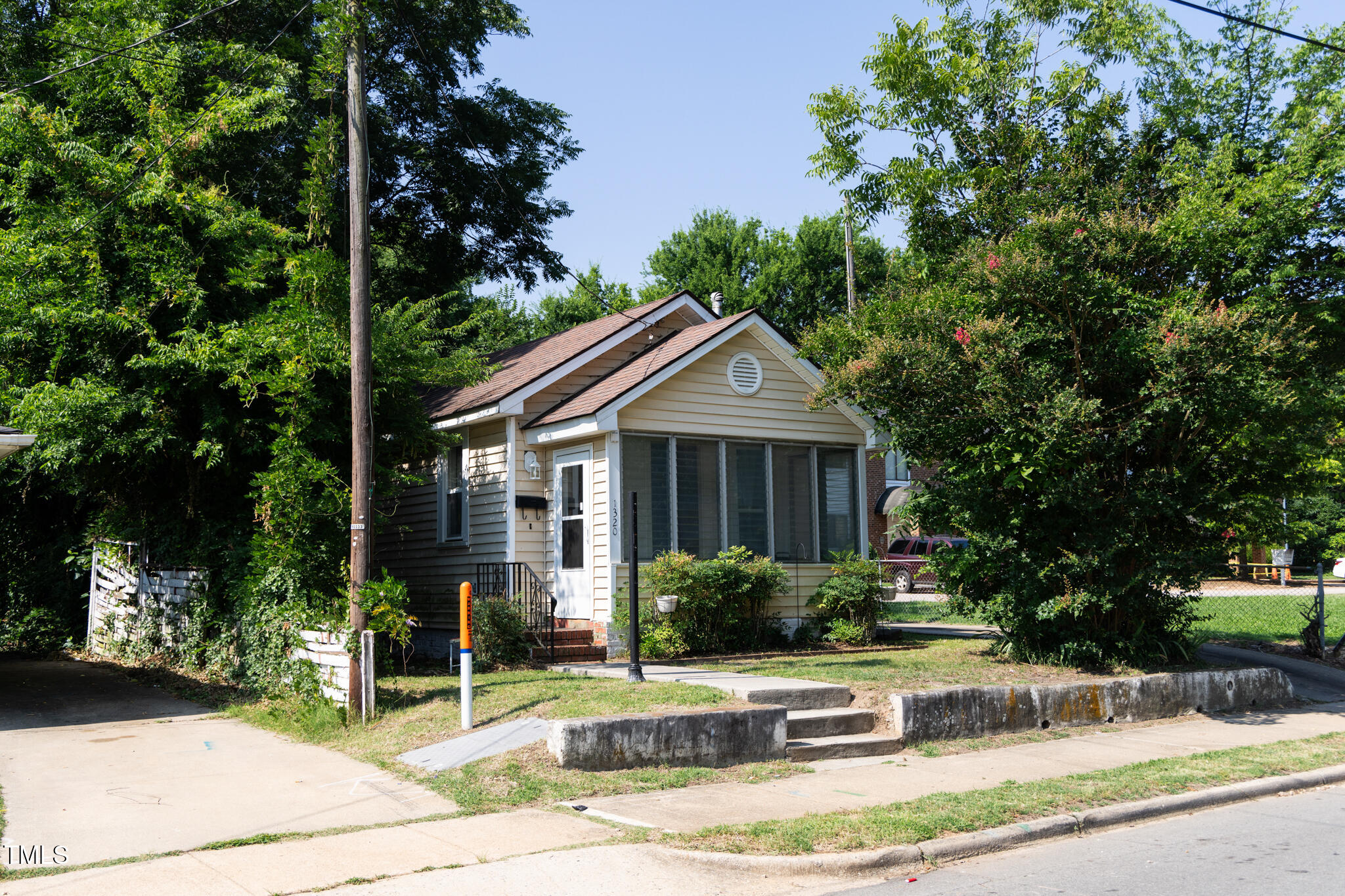 1320 Oakwood Avenue Raleigh, NC 27610 - Photo 2 of 6 a front view of a house with garden