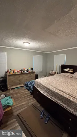 a bedroom with bed and window