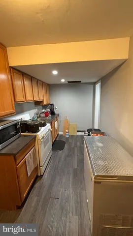 a kitchen with stainless steel appliances granite countertop a stove and a sink