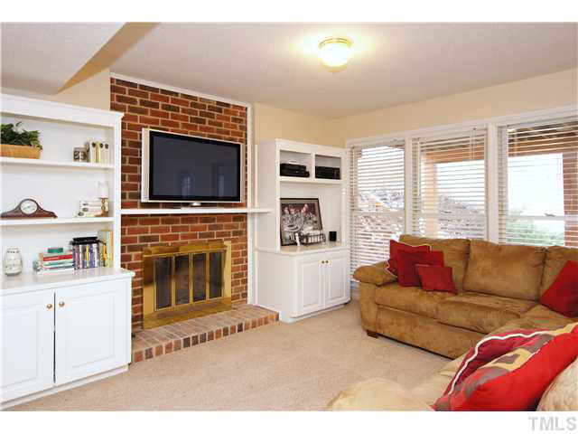 7017 Spring Ridge Road Cary, NC 27518 - Photo 15 of 25 One of the GREAT features of this home is the large finished BASEMENT. Rec room with FP and wet bar : Man-cave for the big game or movie night with the family! You choose! Basement