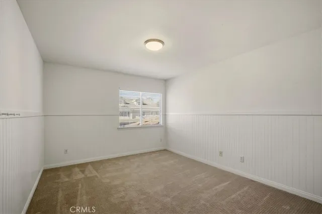 an empty room with a empty space and window