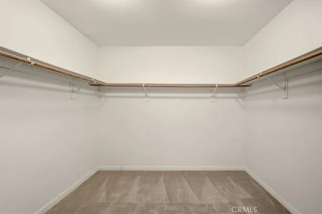 a view of a room with shelf on the wall