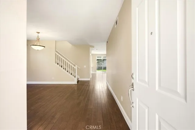 a view of a hallway view with wooden floor