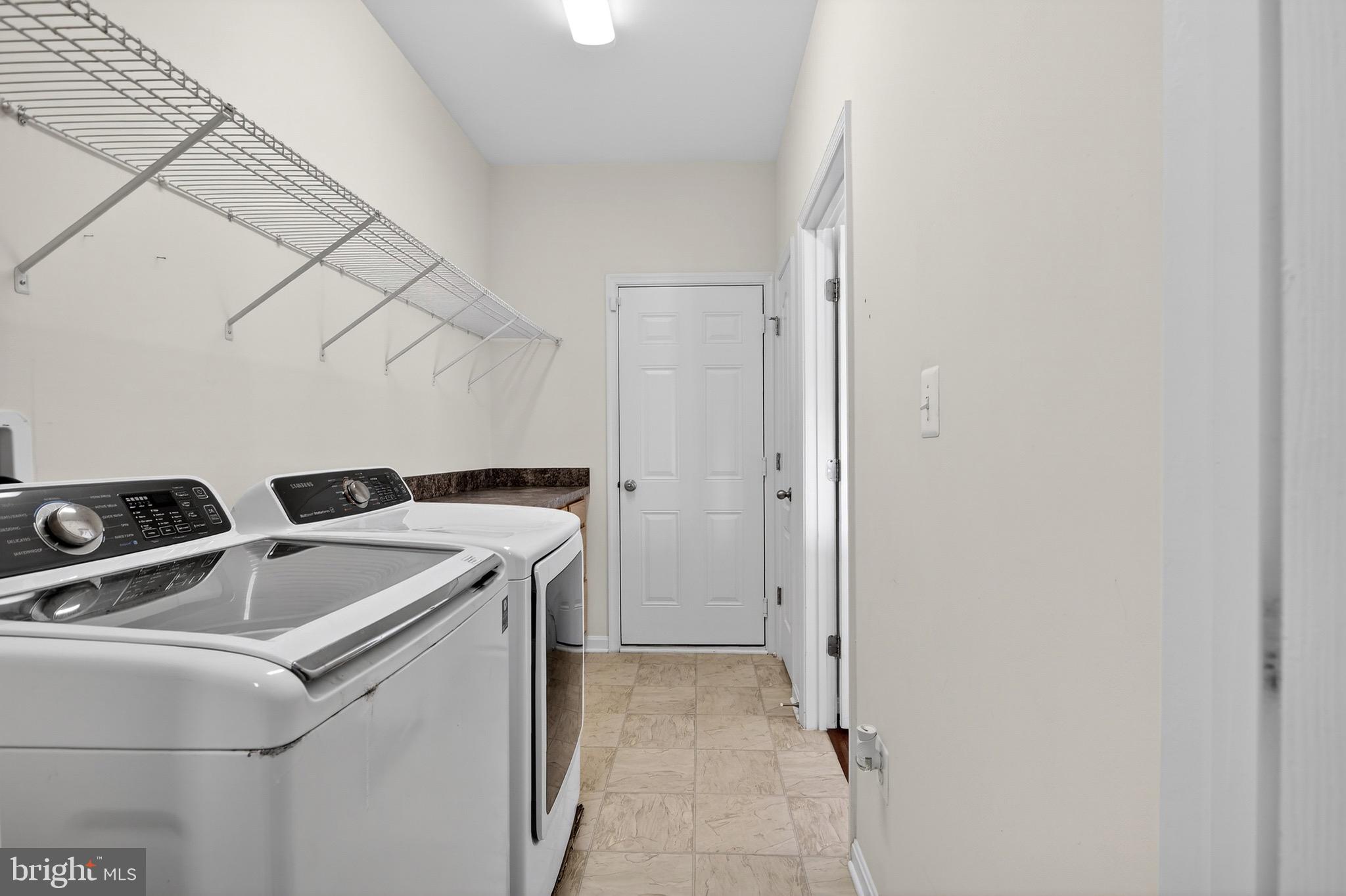 30045 Stage Coach Circle Milford, DE 19963 - Photo 24 of 72 a utility room with dryer and washer