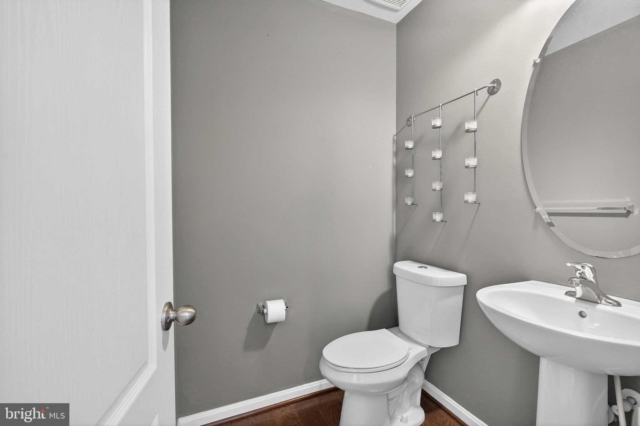 30045 Stage Coach Circle Milford, DE 19963 - Photo 27 of 72 a bathroom with a sink toilet and a mirror