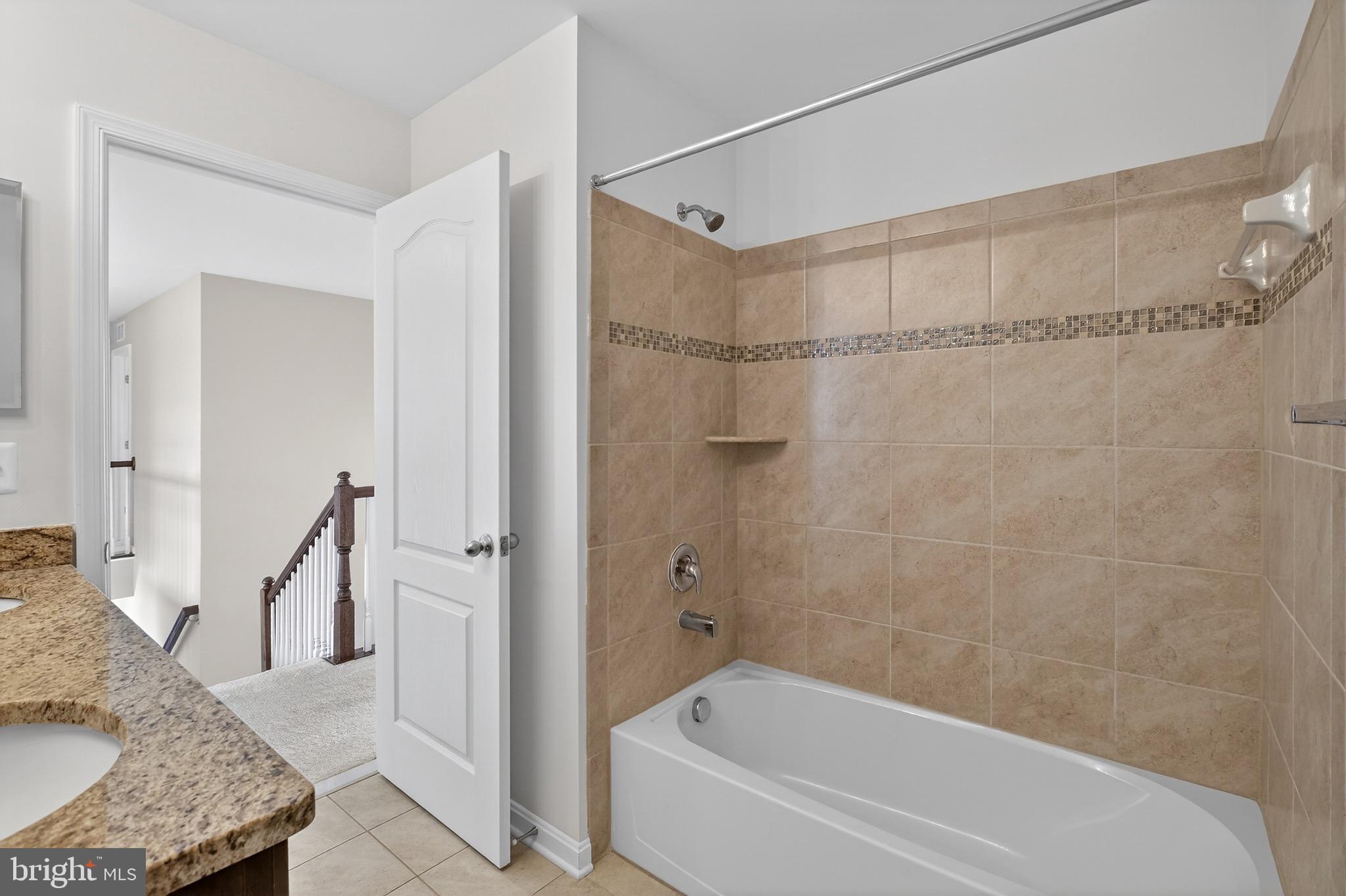 30045 Stage Coach Circle Milford, DE 19963 - Photo 47 of 72 a bathroom with a granite countertop bathtub shower and toilet
