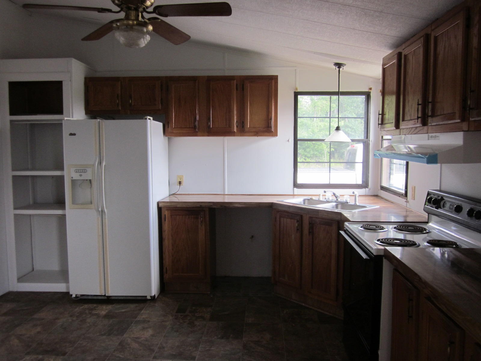 365 Ruritan Road Rocky Mount, VA 24151 - Photo 11 of 33 a kitchen with a refrigerator and a sink