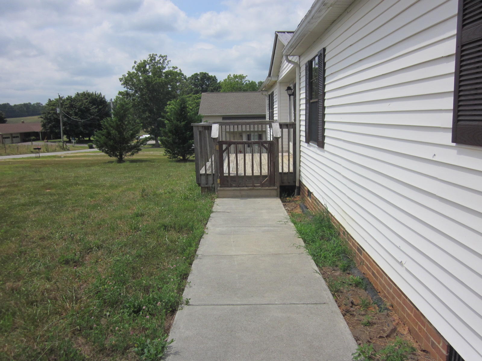 365 Ruritan Road Rocky Mount, VA 24151 - Photo 4 of 33 a backyard of a house with fountain table and chairs